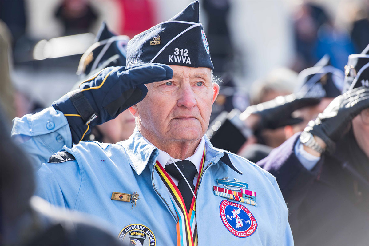 Elderly veteran saluting